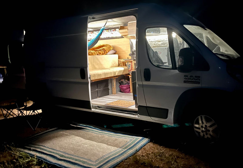  and kitchenette make it a perfect mobile home.|Cozy RV rental camper van interior with a comfy bed — photo 9
