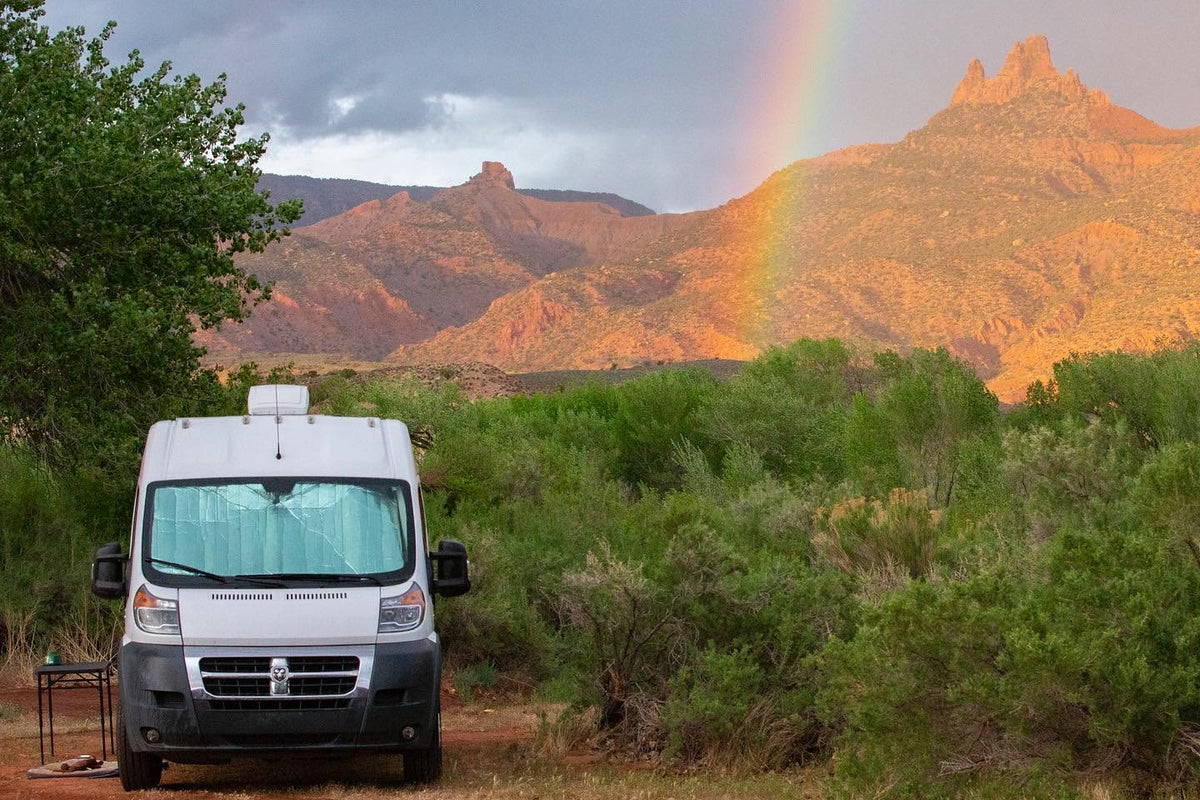 ideal for dog-friendly van life adventures.|Custom RV rental interior with a kitchen counter