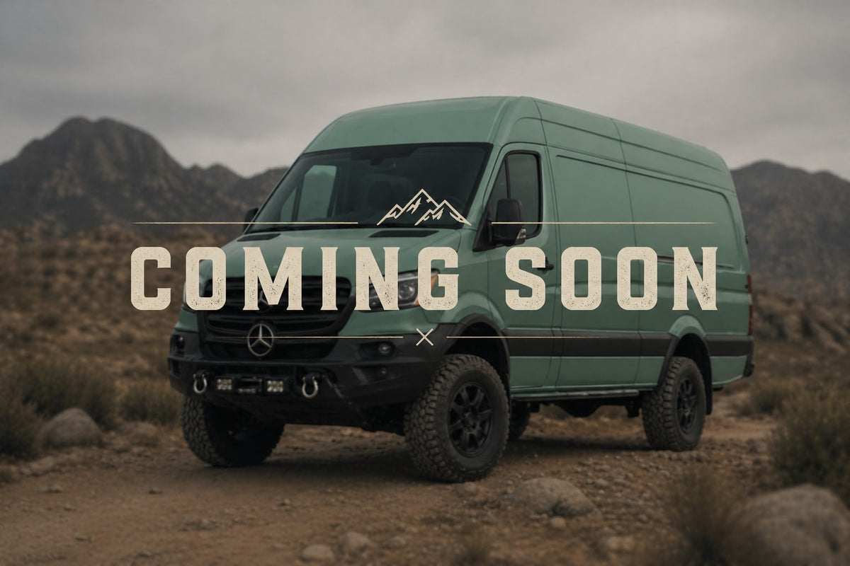 COMING SOON: This rugged green Mercedes Sprinter camper van, perfect for RV rental adventures, is shown off-road in mountains.