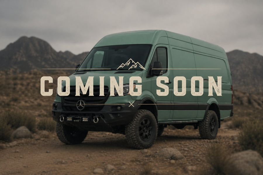 COMING SOON: This rugged green Mercedes Sprinter camper van, perfect for RV rental adventures, is shown off-road in mountains.