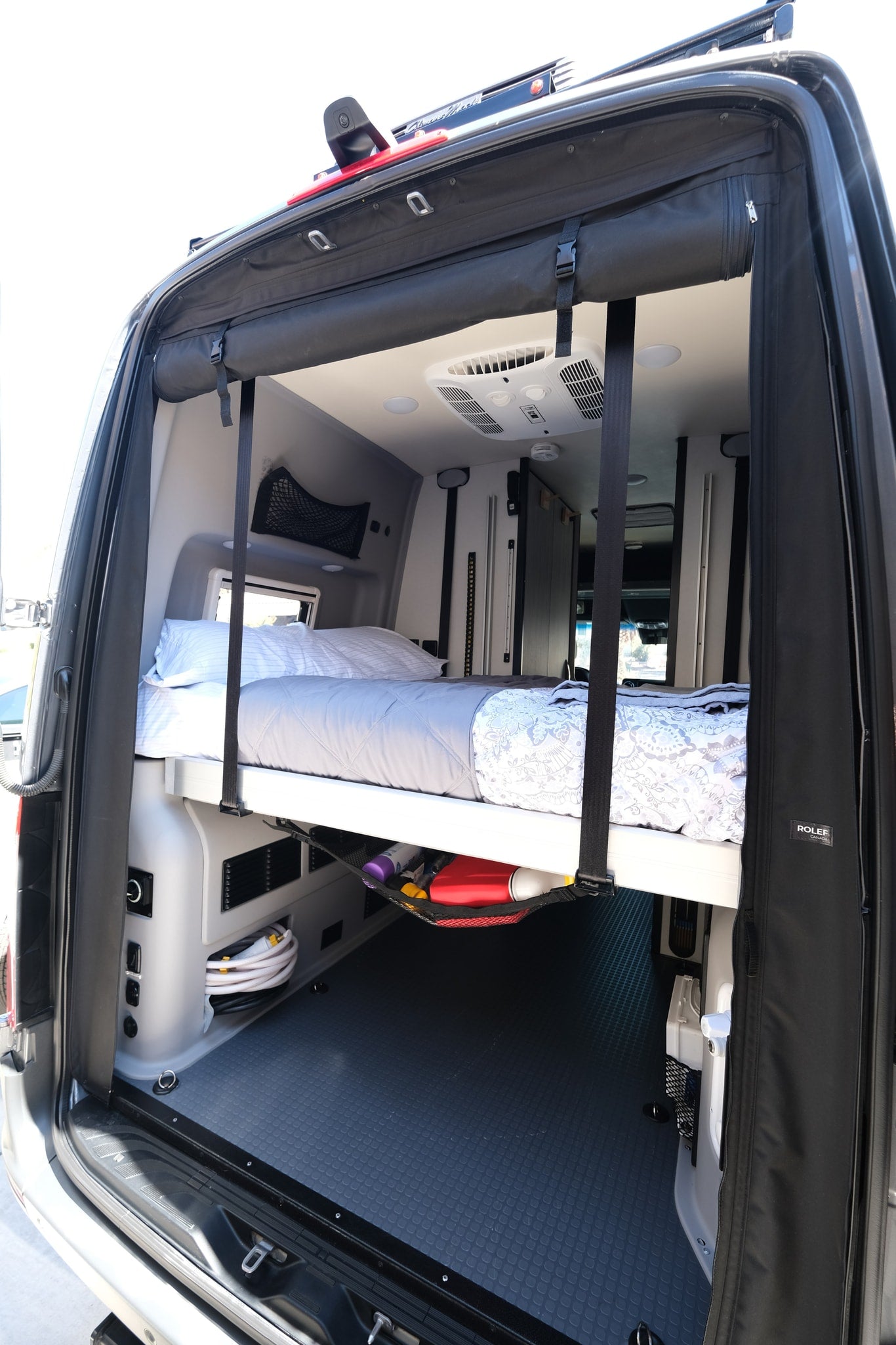  and lush forests. Perfect for an RV rental adventure!|This RV rental compact kitchen features an open fridge — photo 15