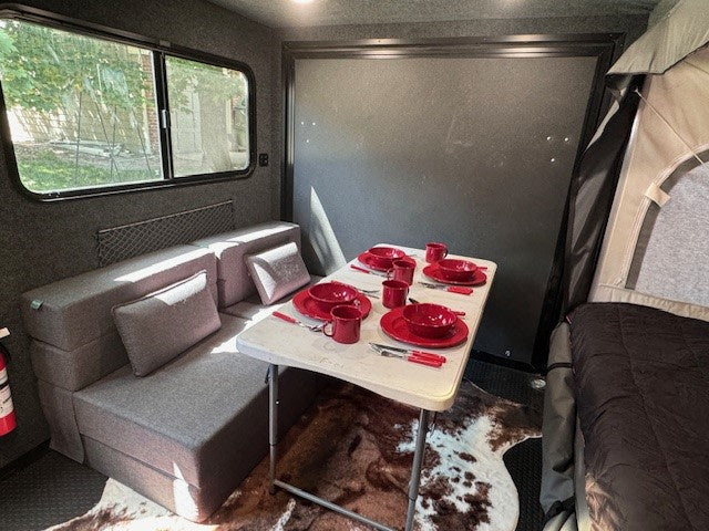  a modern kitchen area with red shelves — photo 15