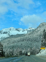 Snowy I-90 drive at Snoqualmie Pass. Mountains & forests blanketed in white; perfect for an rv rental adventure!