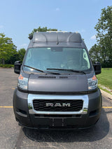 Front of a high-roof, dark gray Ram ProMaster van, often used for rv rental adventures.