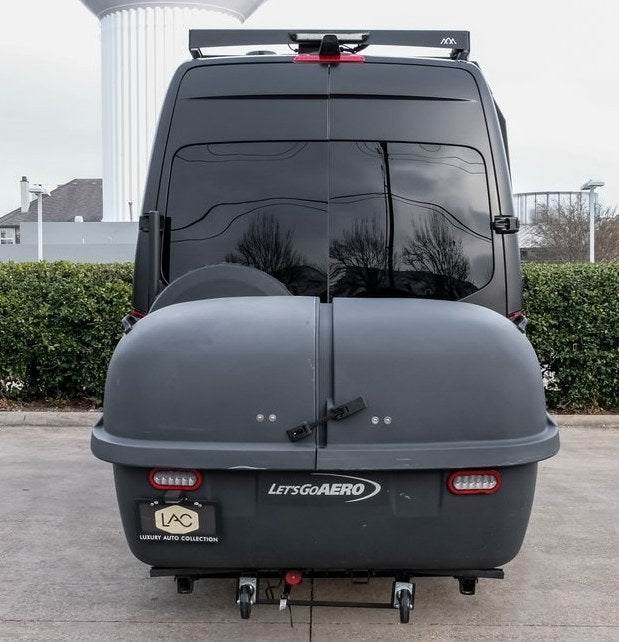  ideal for RV rental. Features custom off-road tires and a roof-mounted light bar.|Spacious front cabin of an RV rental — photo 5