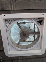 A MaxxAir RV vent fan, common in an rv rental, shows its controls and dirty screen for air circulation.
