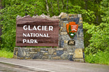 Glacier National Park entrance sign. Start your RV rental adventure exploring lush forests, mountains, and pristine nature.