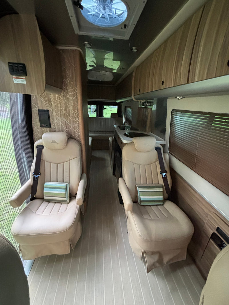  ready for adventure.|Silver Airstream Interstate Mercedes-Benz Sprinter RV rental parked on grass — photo 13