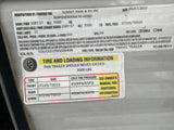 RV rental trailer info label shows VIN, tire size ST235/75D15, cold pressure 65PSI, and 3500 lbs load capacity.