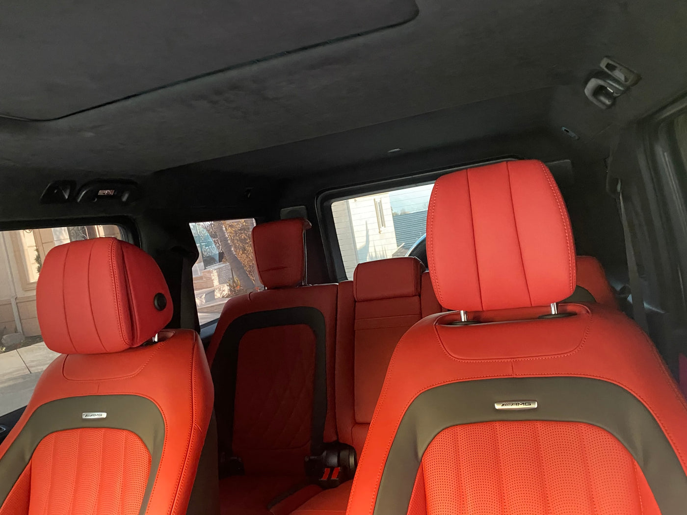Vibrant red leather Mercedes-AMG interior, featuring perforated seats. Ultimate luxury for any adventure, perhaps even an rv rental. — photo 3