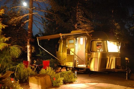  perfect for night adventures outdoors.|Cozy Airstream travel trailer rental illuminated at night — photo 2