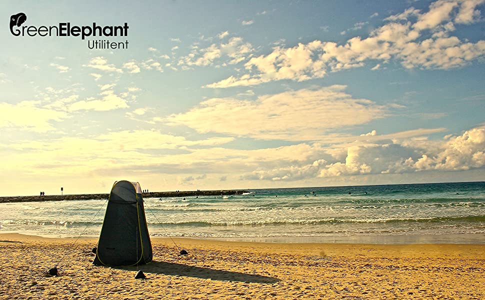 Green Elephant portable tent on a beach, ideal for outdoor privacy near your RV rental for changing or showering.