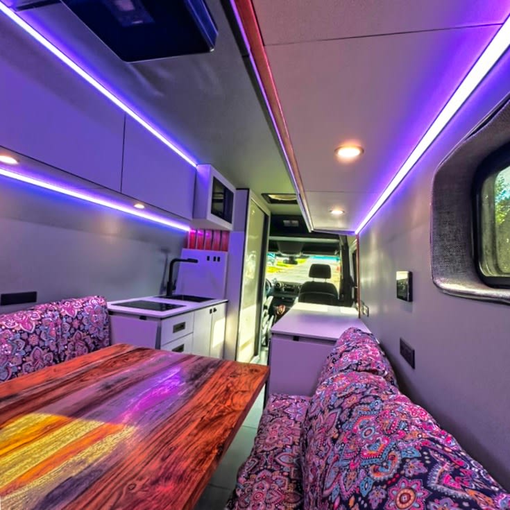 Step inside this colorful RV rental: a custom camper van with purple LED lighting