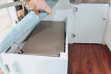 Discover smart **RV rental** storage: a hidden compartment under the bench seat, ideal for a portable fridge or gear.