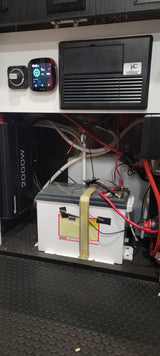 RV rental power system: Renogy 2000W inverter, battery, monitor, and electrical panel with battery switch visible.