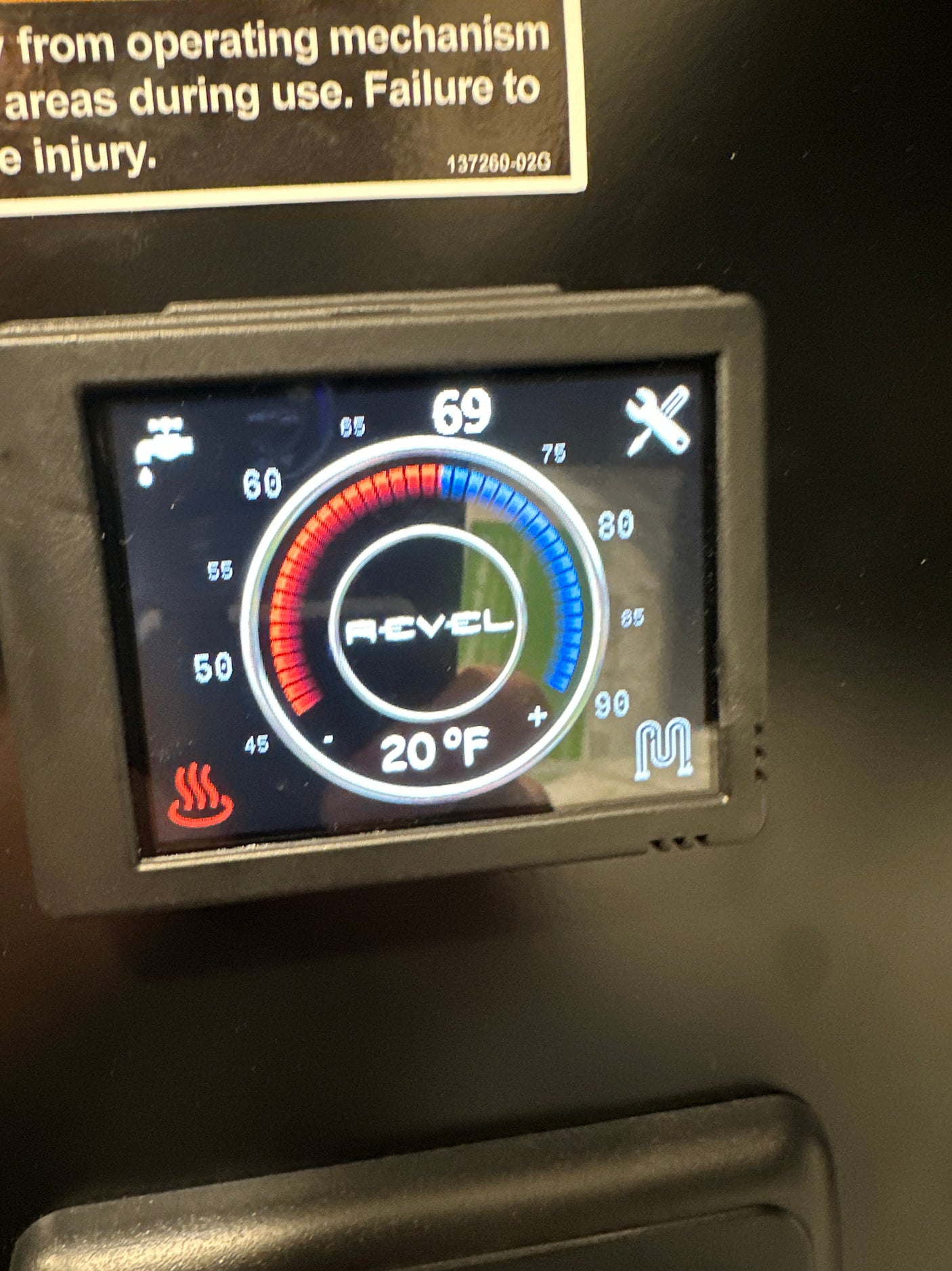 **RV rental** digital control panel. Displays water heater settings: 69 (set) and 20°F (current) with hot/cold indicators.