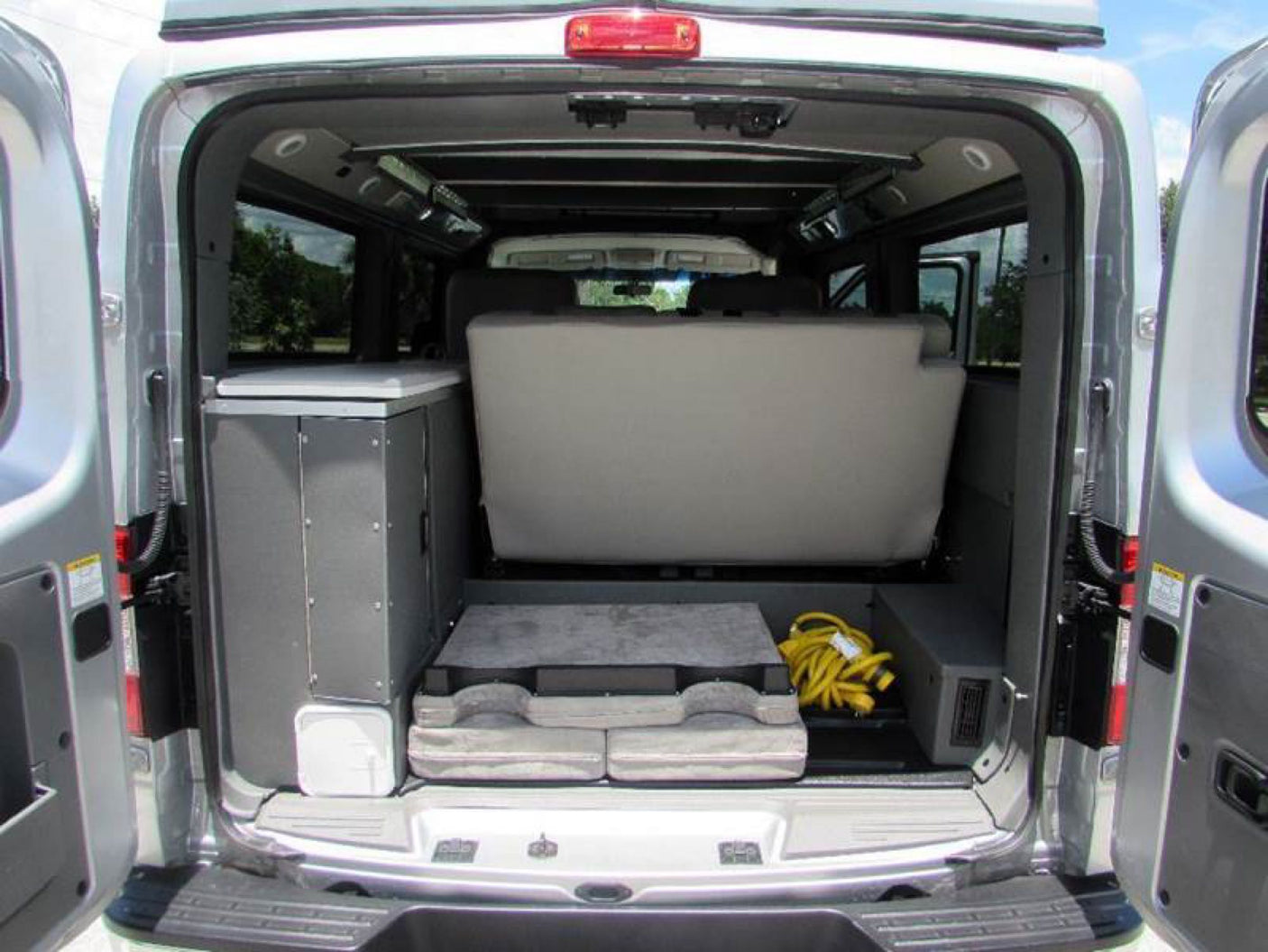  and adventure gear.|Silver custom off-road van