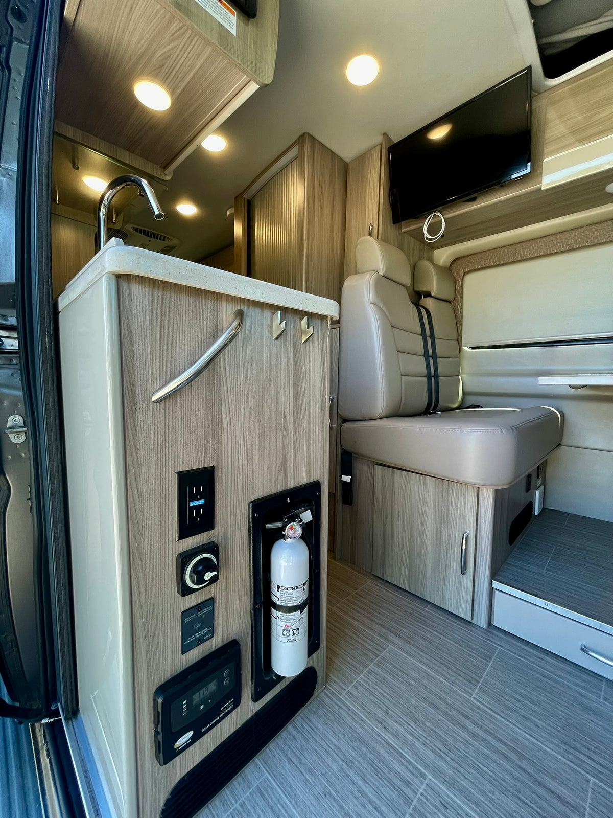  and a bike rack against a blue sky.|Open RV rental with extended awning — photo 12