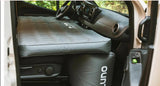 Cozy RV rental interior: an inflatable mattress forms a bed over the front seats for easy van life camping.
