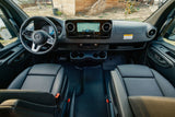 RV rental: Modern Mercedes Sprinter interior with navigation, dashboard, and spacious seating.