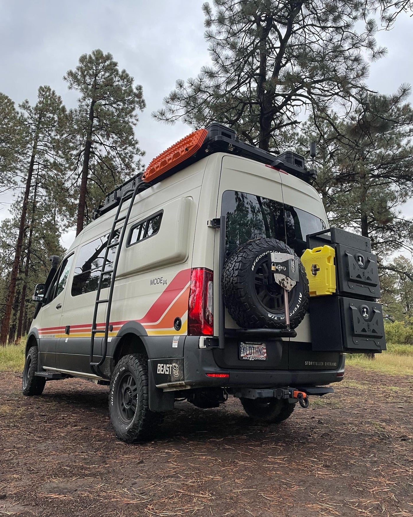  surrounded by red rock mountains and bare trees.|This Storyteller Overland Mode 4x4 adventure van — photo 2