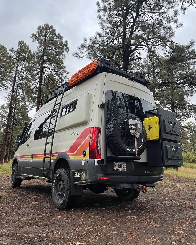  surrounded by red rock mountains and bare trees.|This Storyteller Overland Mode 4x4 adventure van — photo 2