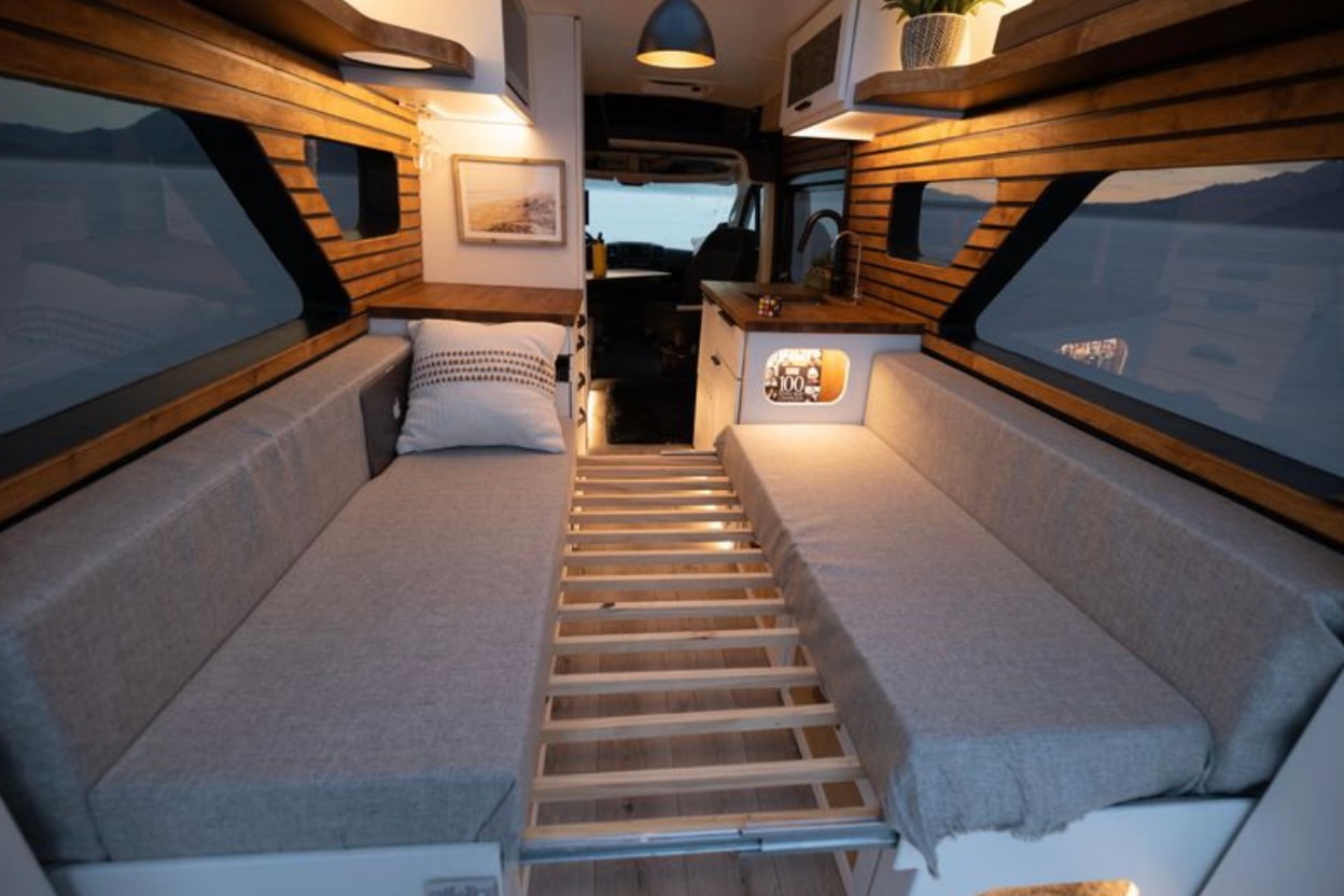  and expansive scenic window views.|Cozy RV rental interior with a functional kitchen — photo 4