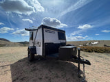 This overland TigerMoth camper trailer is perfect for your next rv rental adventure, parked amidst nature.
