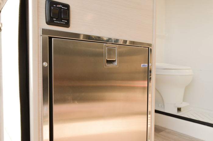  and scenic outdoor views through large windows.|View of a modern rv rental interior: light wood