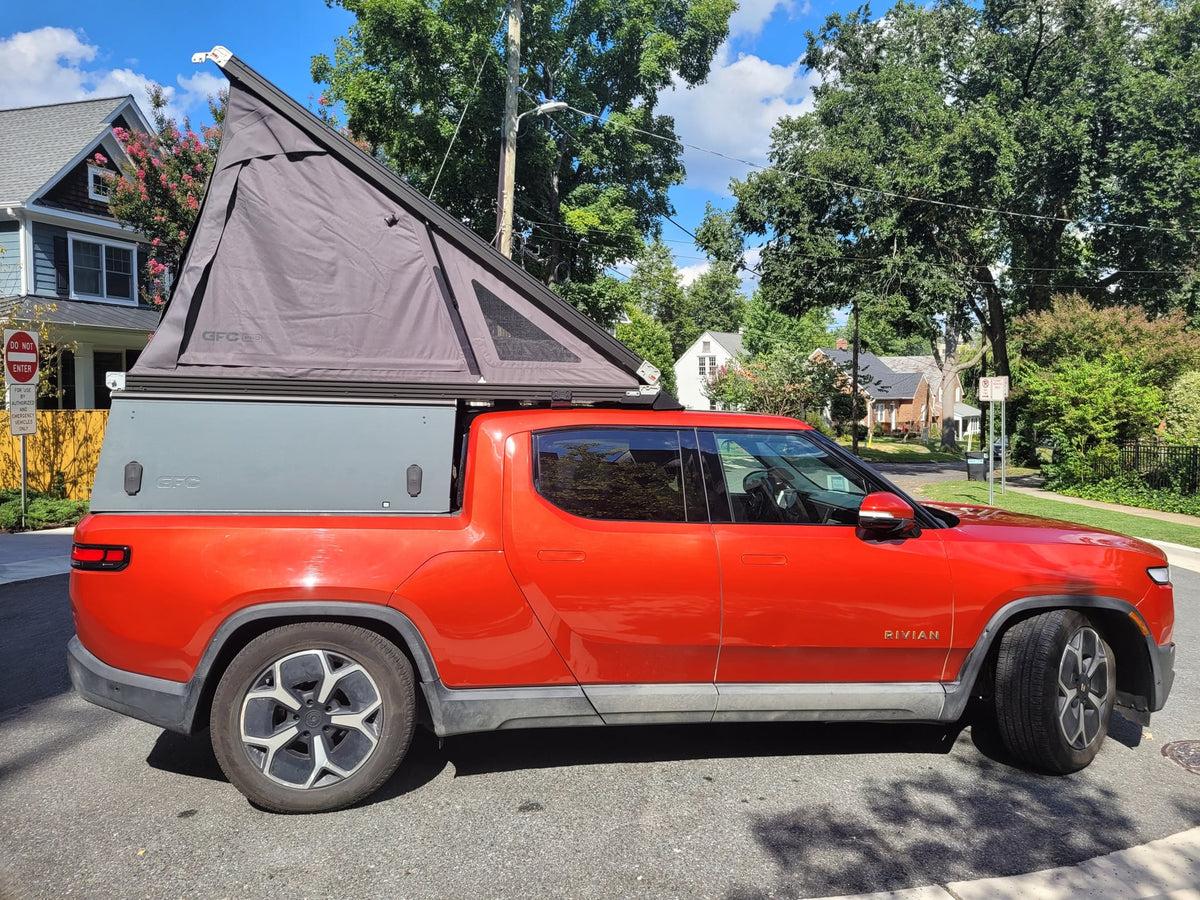  perfect for outdoor adventures or a unique rv rental experience.|Orange Rivian R1T electric pickup truck — photo 20