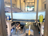 Inside this Canyon Adventure RV rental: a raised bed, dog lounging, and smart storage for your next road trip.