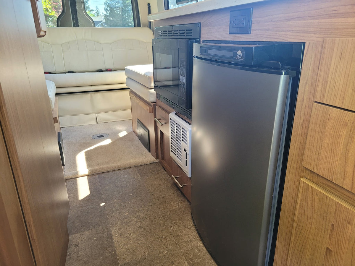  and a control panel on the left.|Explore this bright rv rental interior — photo 11