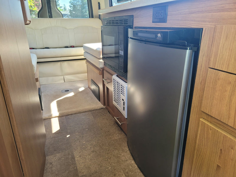  and a control panel on the left.|Explore this bright rv rental interior — photo 11