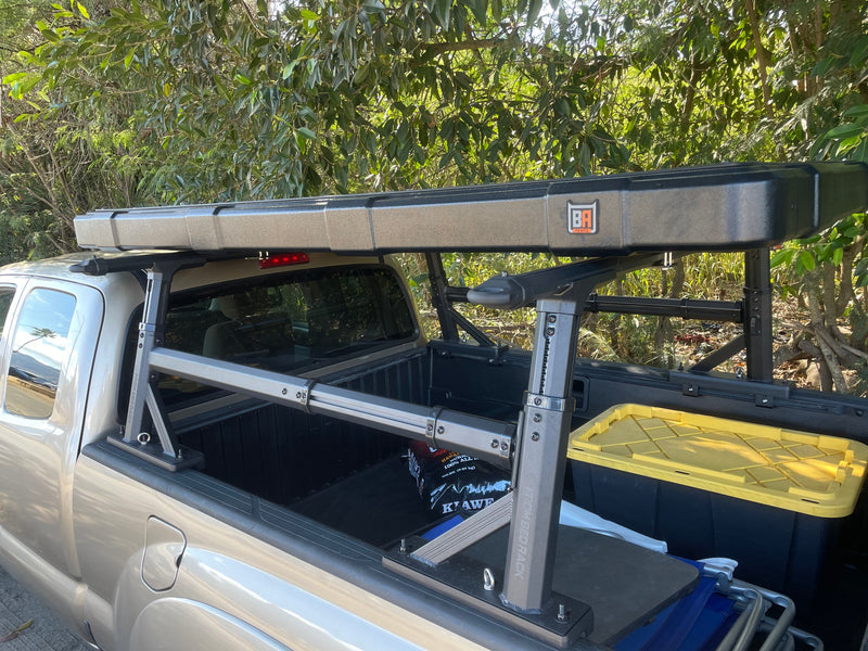 Truck equipped with 'From Bed Rack' and a 'BA Tents' rooftop tent, an ideal RV rental alternative for your overland adventure. — photo 20