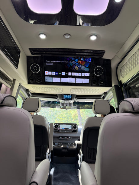 Experience luxury travel in this RV rental's spacious interior, complete with an LG smart TV & plush seating.