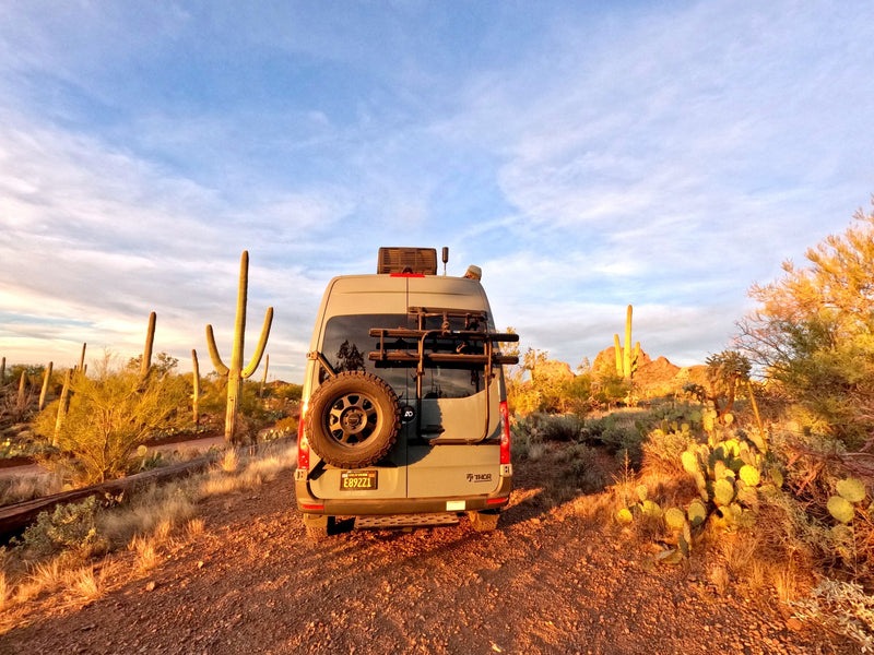  parked amidst large rocks. Ideal for national park adventures.|Gray Mercedes Sprinter **RV rental** parked in a sunny — photo 14