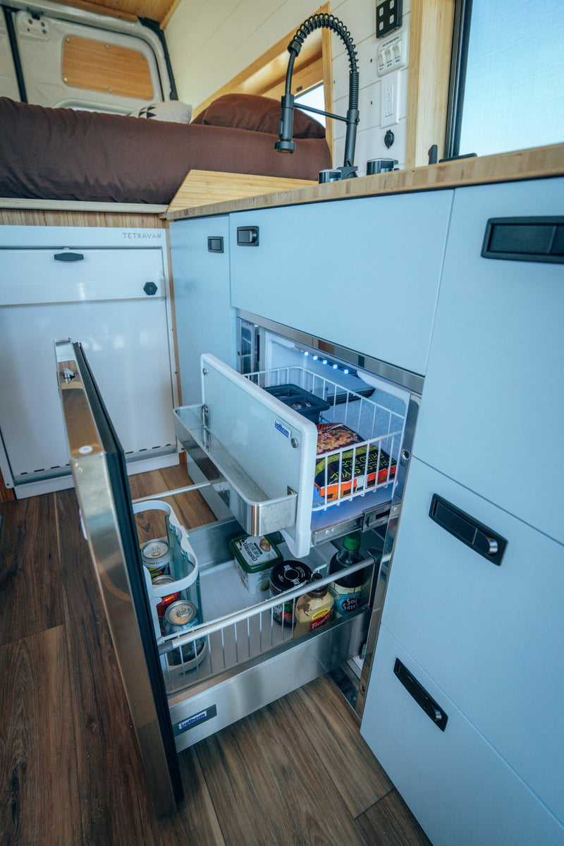  and a warm wooden ceiling.|Modern RV rental camper van interior: compact kitchen — photo 8