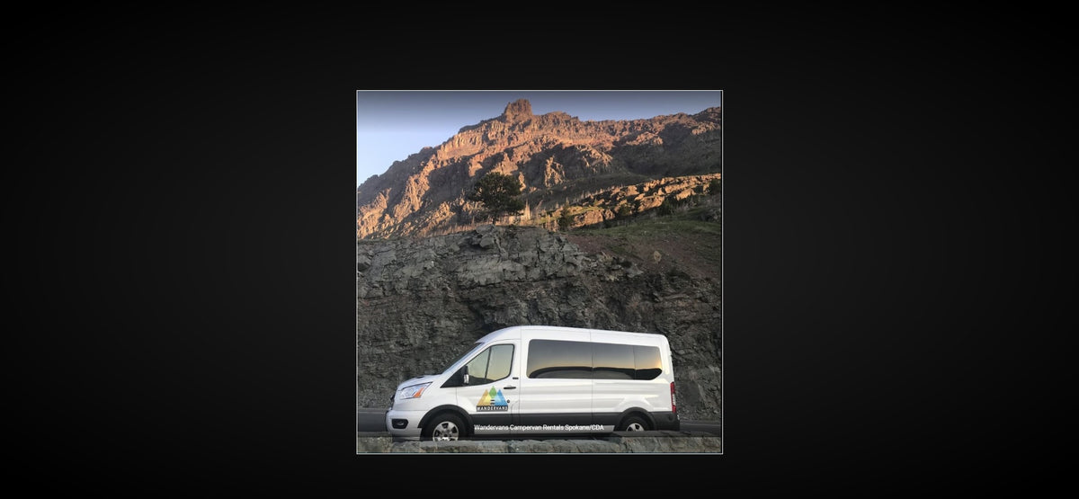 White Wandervans rv rental van on a scenic mountain road, ready for rugged terrain adventures. — photo 11
