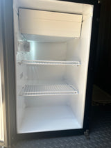 Clean, empty mini-fridge interior with shelves & freezer unit, ready for guests in this rv rental.