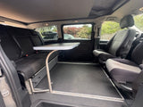 Inside this versatile rv rental campervan: a pull-out table, adaptable seating, and durable flooring for your road trip comfort.