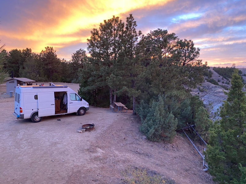  and an outdoor window view.|Cozy RV rental interior: wood-paneled walls — photo 19