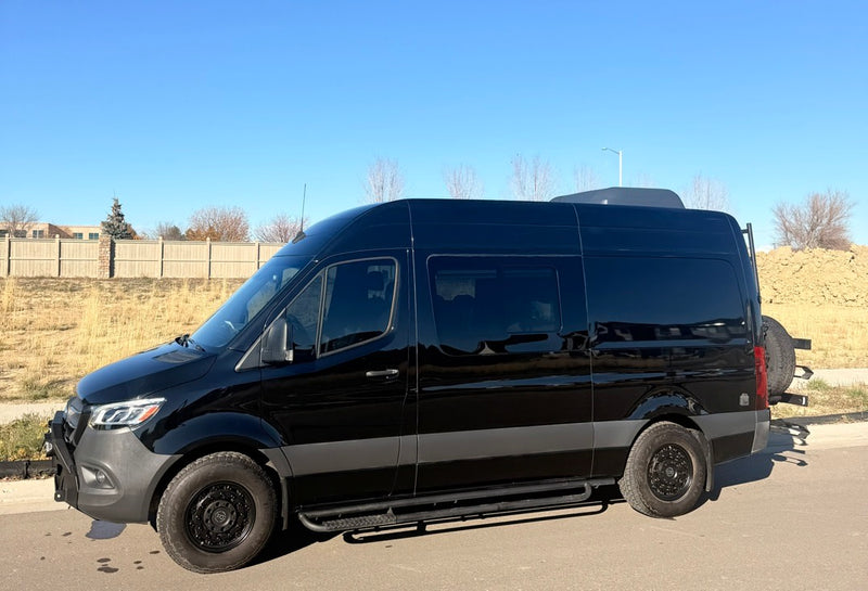 Sleek black Mercedes Sprinter camper van RV rental — photo 1