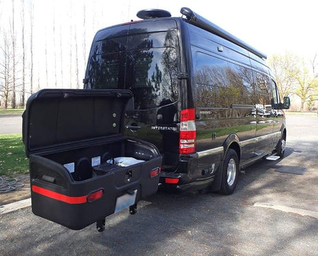 Black Airstream Interstate RV rental with its rear storage box open, showing extra space for your travel adventures.