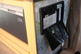 RV rental interior: a CFX cooler, wooden cabinetry, and a WFCO power panel with visible circuit breakers.