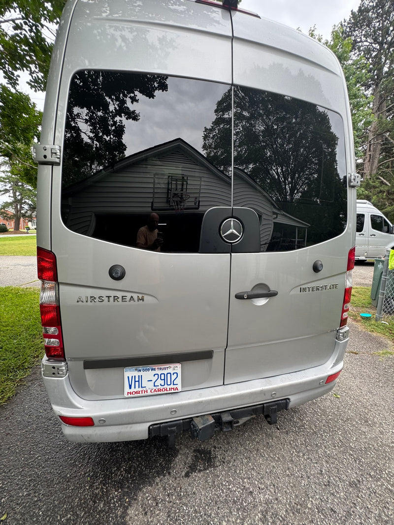 Silver Airstream Interstate RV rental, seen from the rear with NC plate VHL-2902 & Mercedes-Benz badging. Perfect for travel! — photo 7