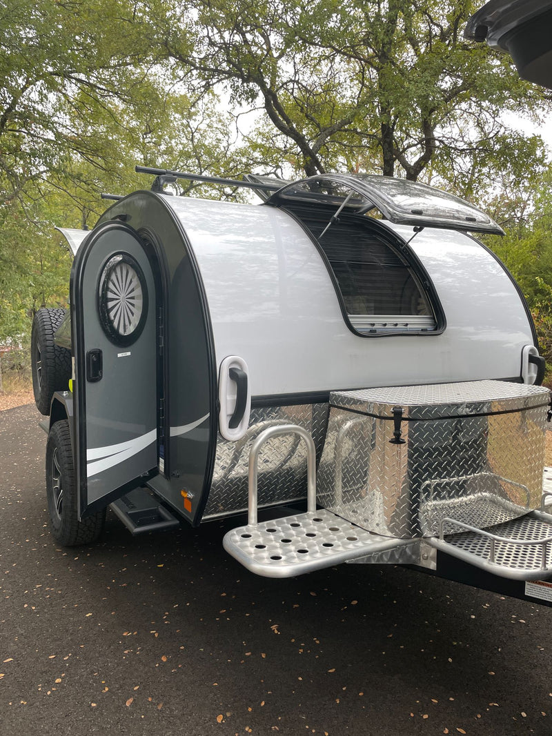  fridge for camping adventures.|Fresh coffee brewing in a blue Moka pot on a stove in a compact rv rental kitchen — photo 10