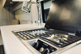 RV rental kitchen: compact Dometic stove, sink with filter. Perfect for travel convenience.