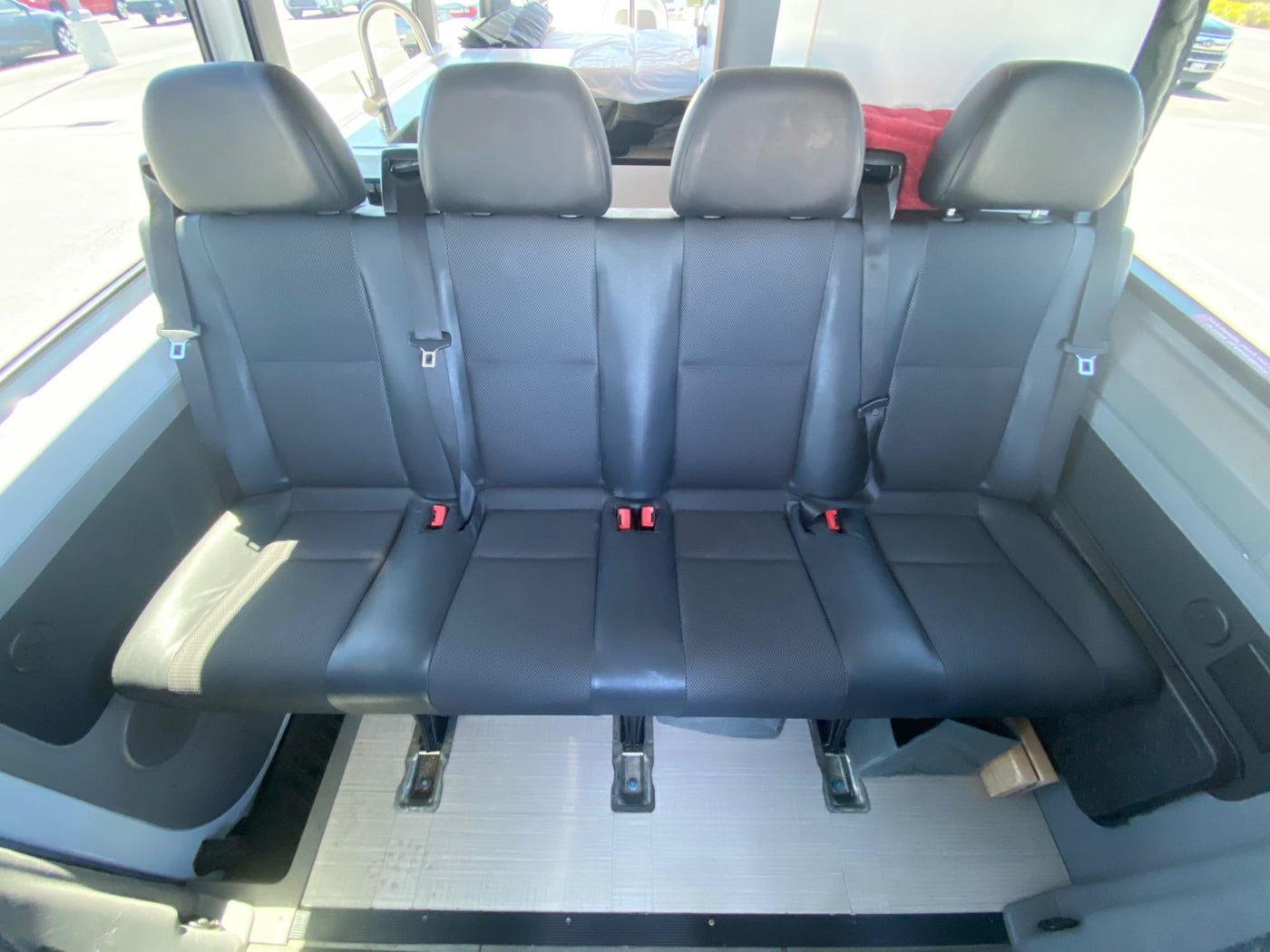  and padded window cover.|Inside an rv rental van: a comfortable bed setup — photo 6