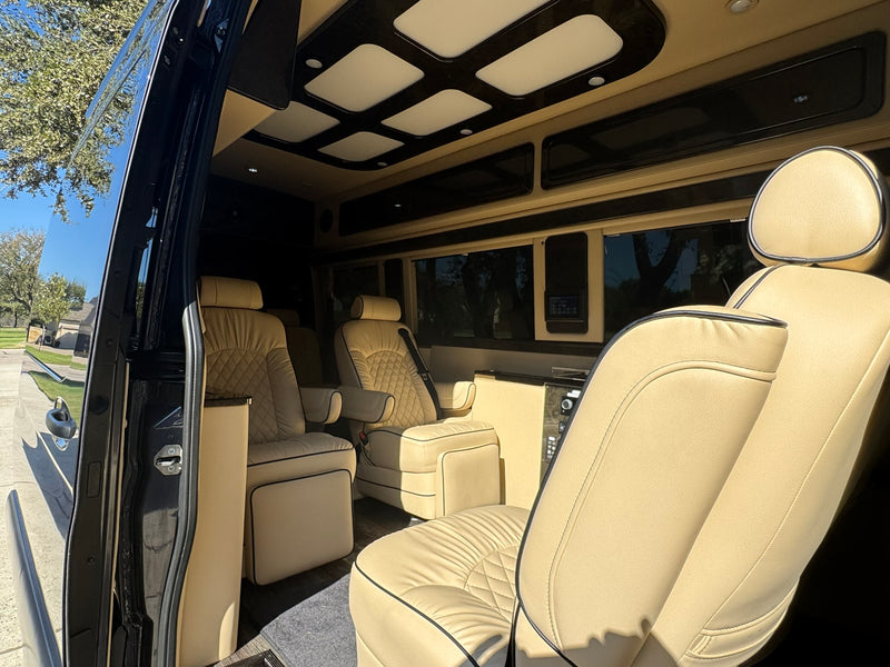  ideal for your next RV rental. This sleek camper van features dark windows & side steps.|RV rental: Rear view of a custom camper van with open doors — photo 4