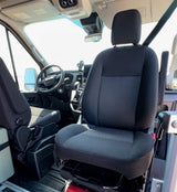 RV rental interior: View of the front seats, dashboard, and steering wheel in a spacious van.